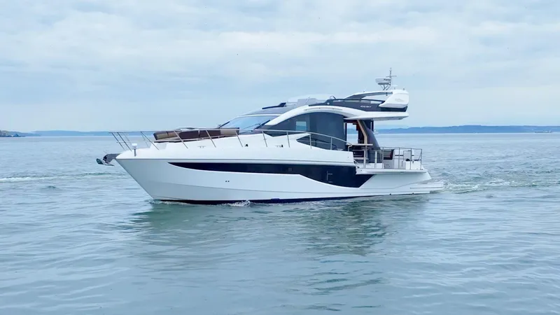 Slide: The Image of 2024 Galeon 470 Sky yacht cruising on calm waters. - 2