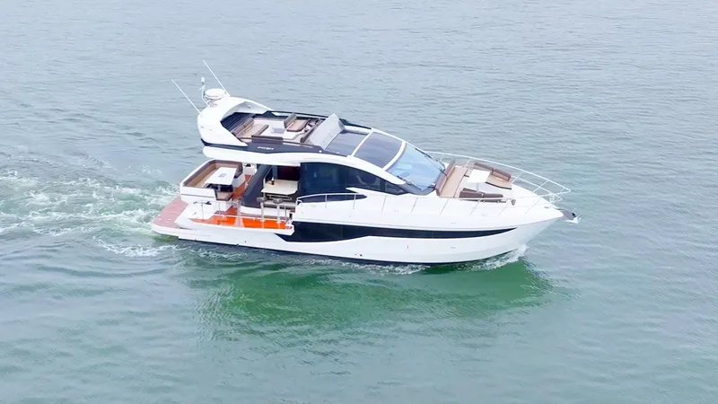 Slide: The Image of 2024 Galeon 470 Sky yacht cruising on open water. - 3