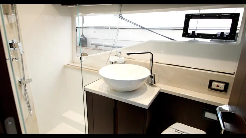 Slide: The Image of Modern bathroom in 2024 Galeon 470 Sky yacht with sleek fixtures and a vessel sink. - 30