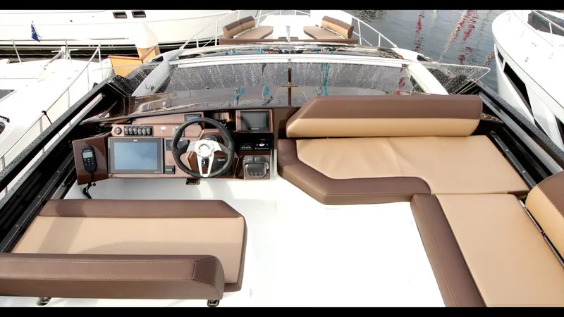 Slide: The Image of 2024 Galeon 470 Sky yacht cockpit with modern navigation system and luxurious seating. - 33