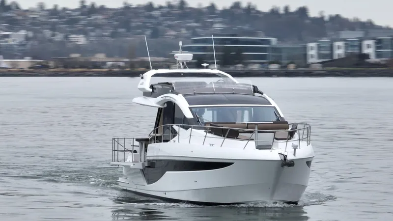 Slide: The Image of 2024 Galeon 470 Sky yacht cruising on a calm waterway. - 4