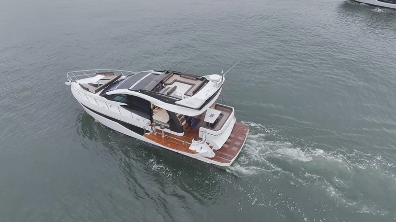 Slide: The Image of 2024 Galeon 470 Sky yacht cruising on open water. - 7