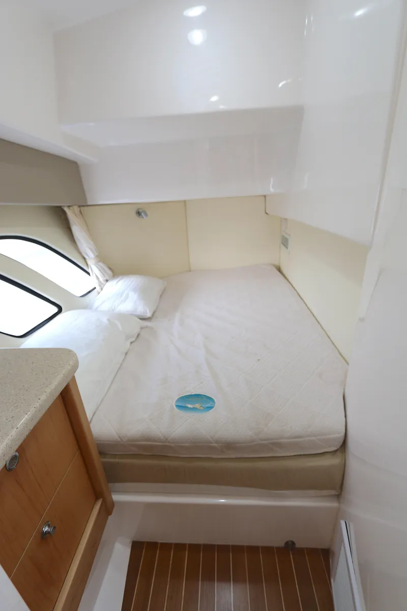 Slide: The Image of Interior cabin of 2012 Intrepid 475 Sport Yacht with bed and wooden flooring. - 10