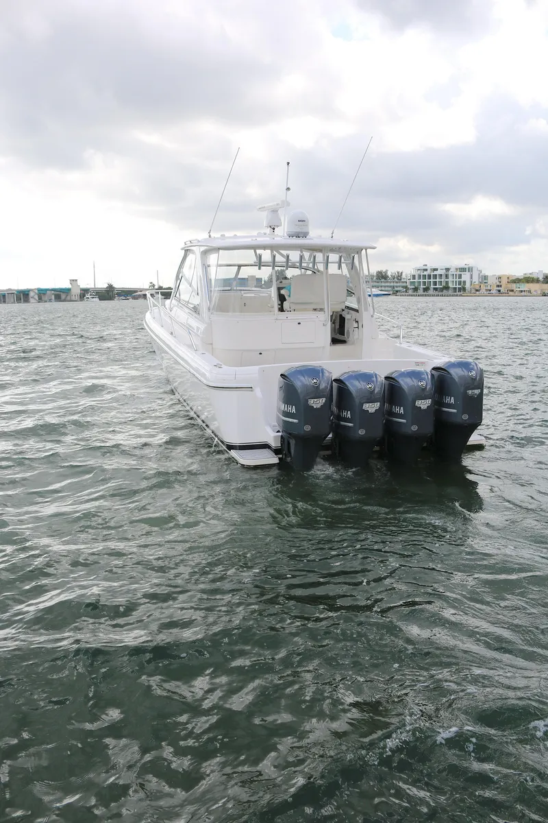 Slide: The Image of 2012 Intrepid 475 Sport Yacht with four outboard engines on the water. - 22