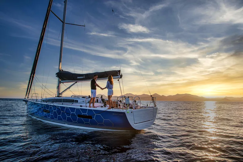 Slide: The Image of 2026 Dehler 46 yacht sailing with crew on a sunny day. - 48