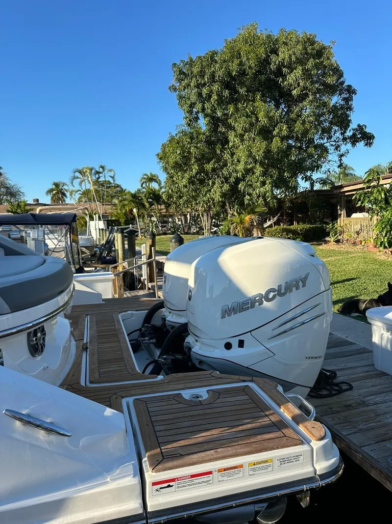 Slide: The Image of 2021 Sea Ray SLX 310 OB with Mercury outboard engines docked. - 10