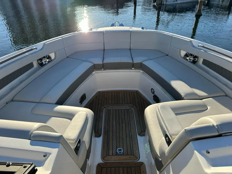 Slide: The Image of 2021 Sea Ray SLX 310 OB boat with spacious seating and teak flooring. - 14