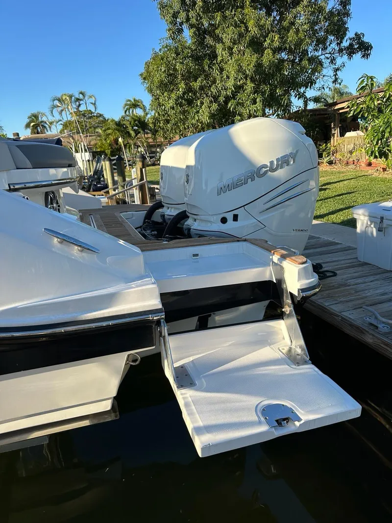 Slide: The Image of 2021 Sea Ray SLX 310 OB with Mercury outboard engine docked. - 20