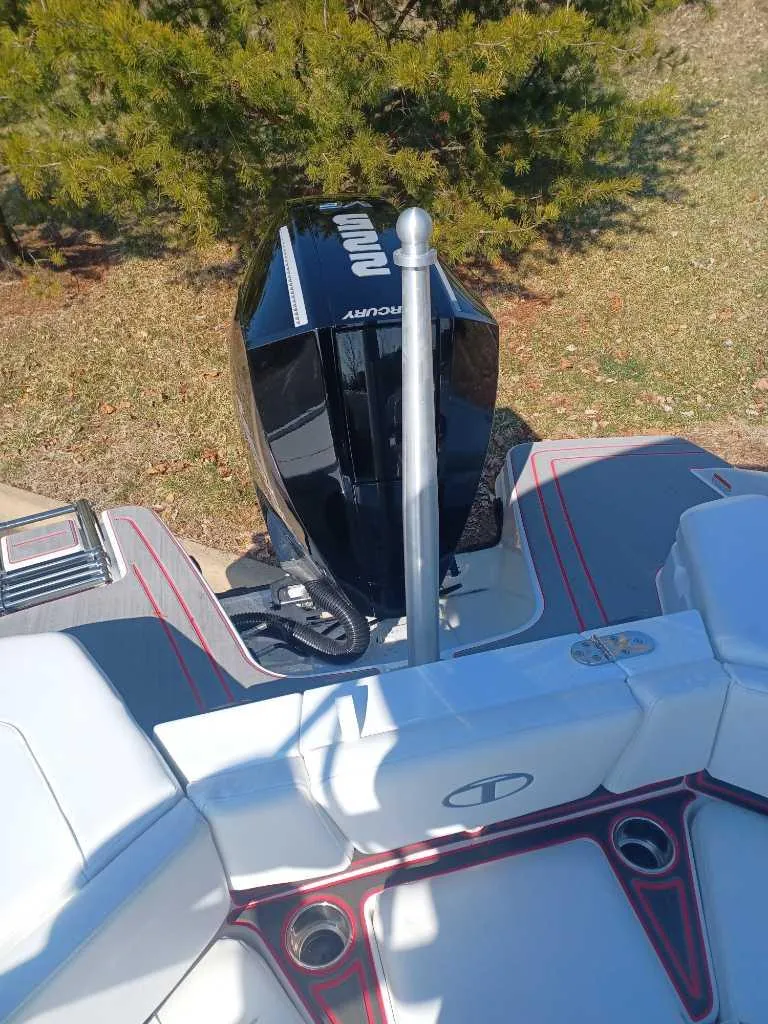 Slide: The Image of 2024 Tahoe 210 S Limited boat with Mercury outboard motor. - 6