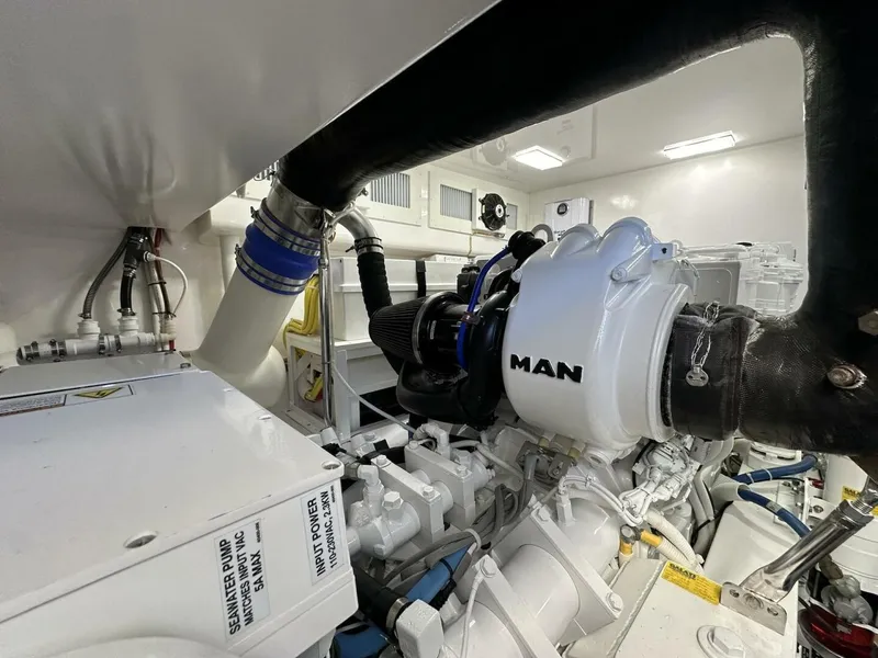Slide: The Image of Engine room of 2022 Viking 44 Sport Coupe with MAN engine components. - 37