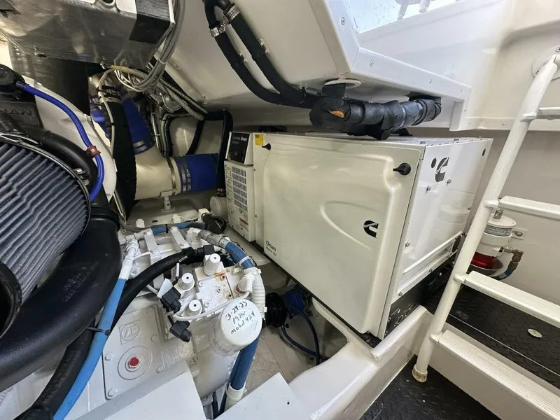 Slide: The Image of Engine room of 2022 Viking 44 Sport Coupe, showcasing mechanical components and systems. - 39