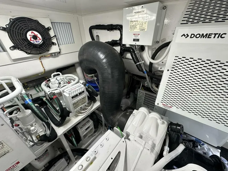 Slide: The Image of Engine room of 2022 Viking 44 Sport Coupe with Dometic equipment and ventilation system. - 47