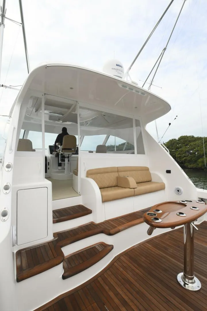 Slide: The Image of 2022 Viking 44 Sport Coupe yacht with sleek design and luxurious seating. - 5
