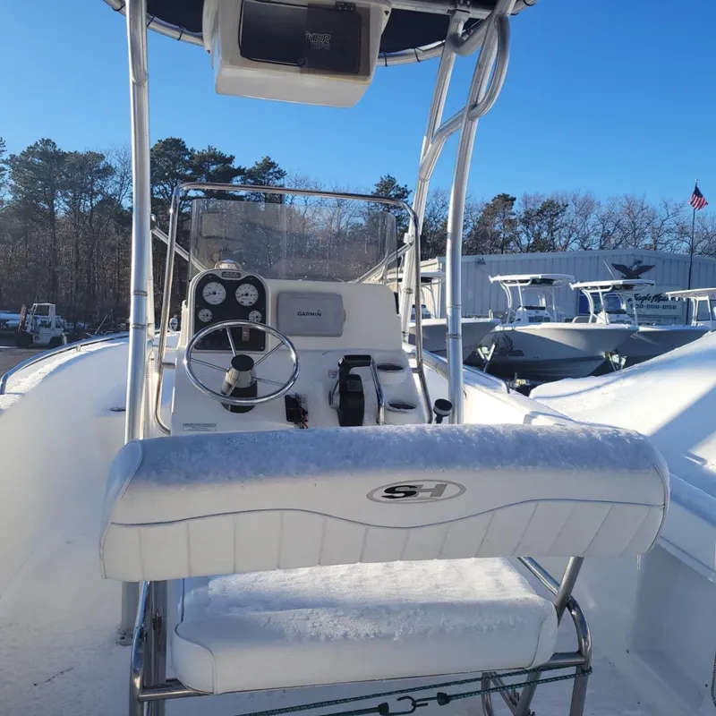 Slide: The Image of 2013 Sea Hunt 182 Center Console boat with snowy deck and control panel. - 3