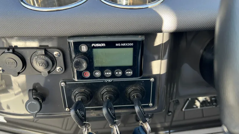 Slide: The Image of Control panel of 2021 Monterey 385 SE boat with Fusion MS-NRX300 stereo. - 12