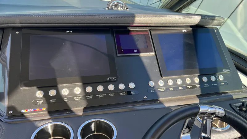 Slide: The Image of Monterey 385 SE 2021 dashboard with dual screens and control buttons. - 13