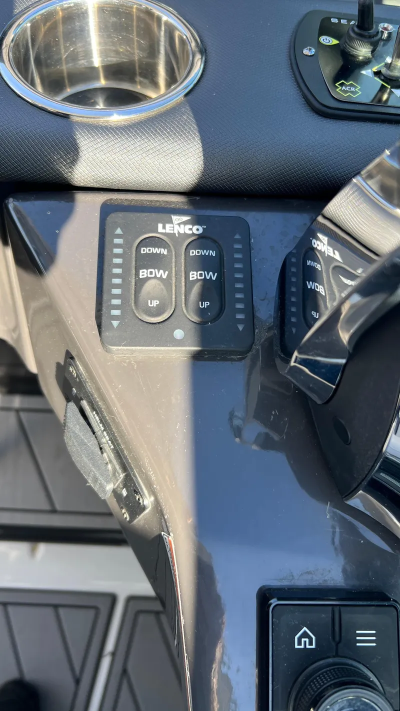 Slide: The Image of Control panel of 2021 Monterey 385 SE boat with Lenco trim tab switches. - 15