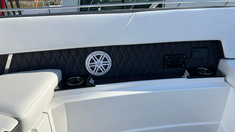 Slide: The Image of 2021 Monterey 385 SE boat interior with speaker and cup holders. - 16