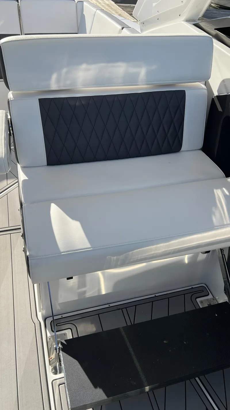 Slide: The Image of 2021 Monterey 385 SE boat seat with white and black upholstery. - 17