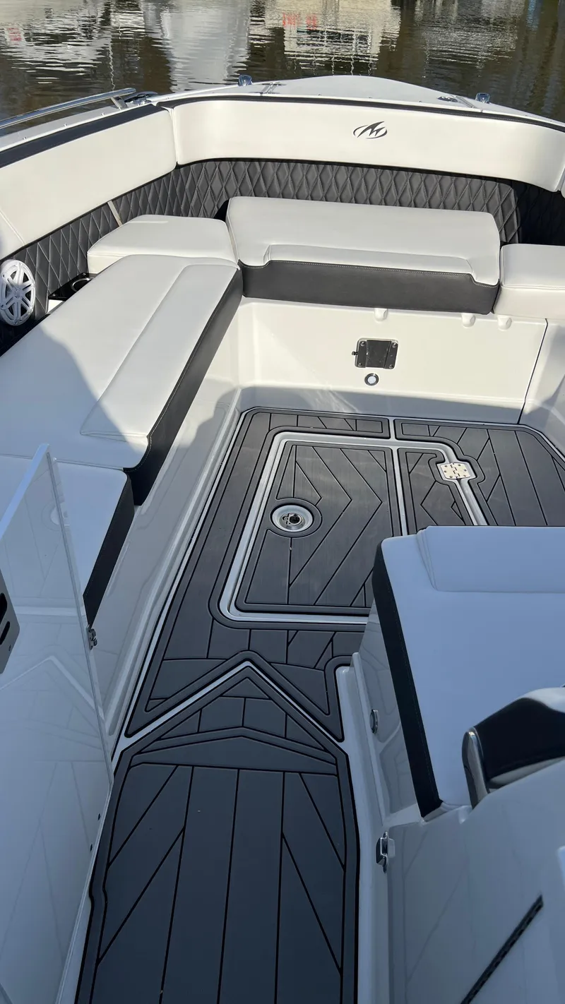 Slide: The Image of 2021 Monterey 385 SE boat interior with sleek seating and modern flooring design. - 20