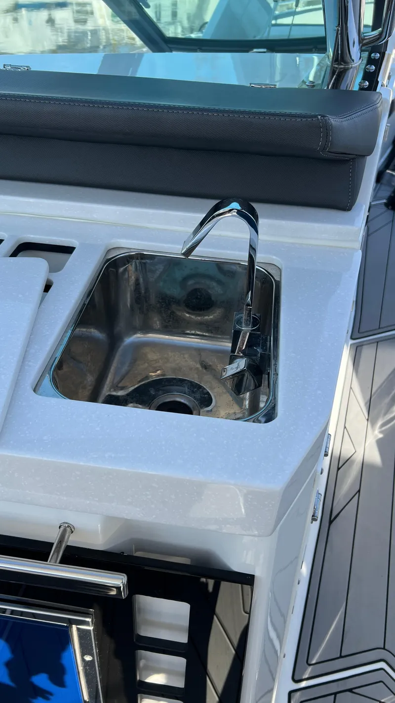 Slide: The Image of Stainless steel sink on 2021 Monterey 385 SE boat deck. - 22