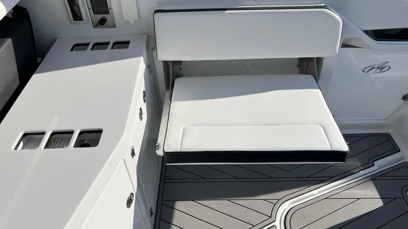 Slide: The Image of 2021 Monterey 385 SE boat interior with white seating and sleek design. - 23
