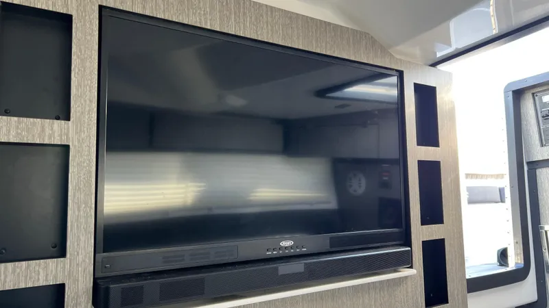 Slide: The Image of Flat-screen TV in 2021 Monterey 385 SE boat interior. - 26