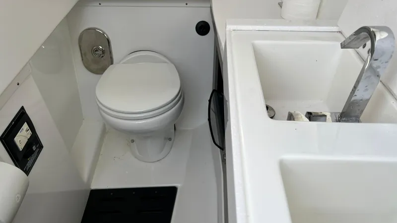 Slide: The Image of 2021 Monterey 385 SE boat bathroom with toilet and sink. - 32