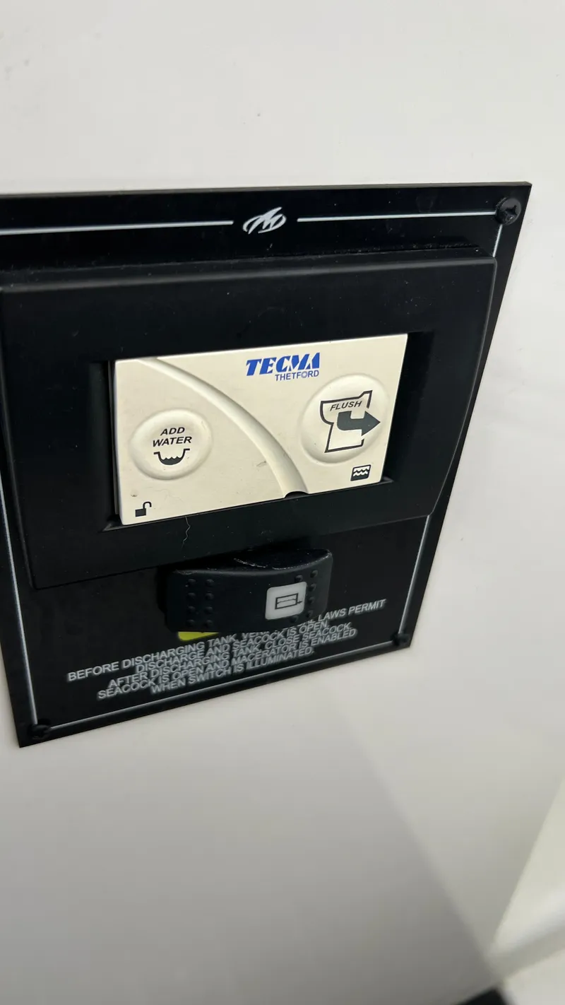 Slide: The Image of Monterey 385 SE 2021 control panel with Thetford Tecma flush and add water buttons. - 33