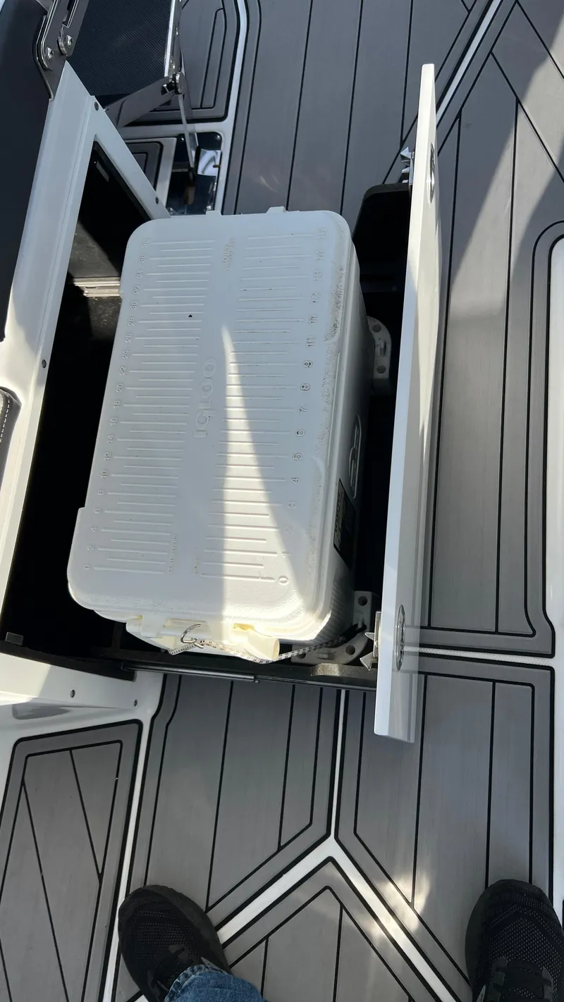 Slide: The Image of 2021 Monterey 385 SE boat deck with storage compartment open. - 34