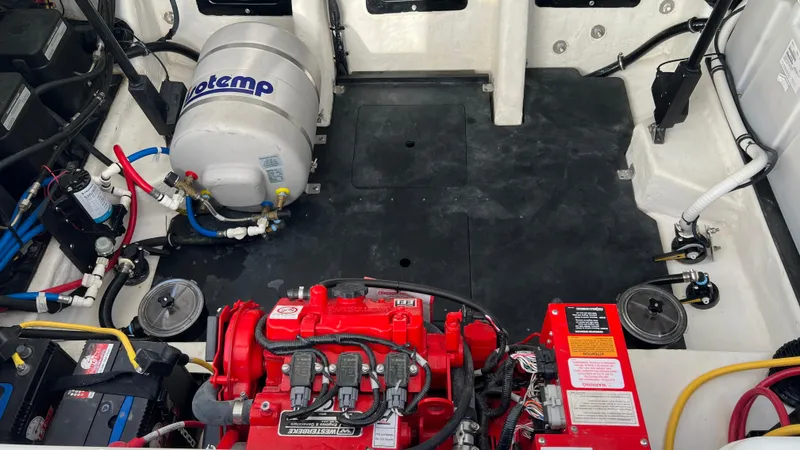 Slide: The Image of Engine compartment of a 2021 Monterey 385 SE boat with mechanical components. - 37
