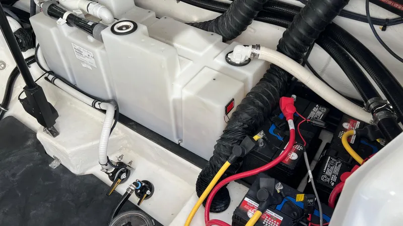 Slide: The Image of Engine compartment of a 2021 Monterey 385 SE boat with batteries and wiring. - 38