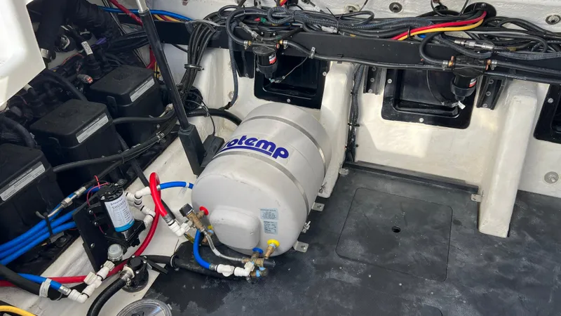 Slide: The Image of Engine compartment of 2021 Monterey 385 SE boat with wiring and equipment. - 39