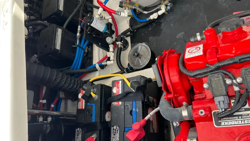 Slide: The Image of Engine compartment of a 2021 Monterey 385 SE boat with batteries and wiring. - 40
