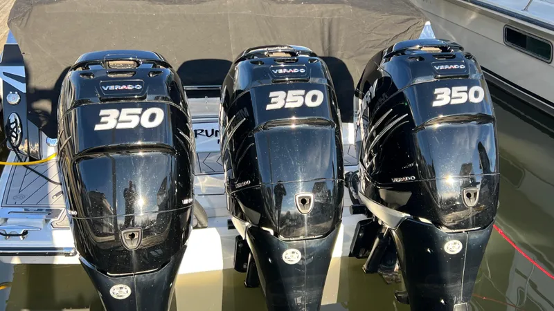 Slide: The Image of Three black Verado 350 outboard engines on a 2021 Monterey 385 SE boat. - 42