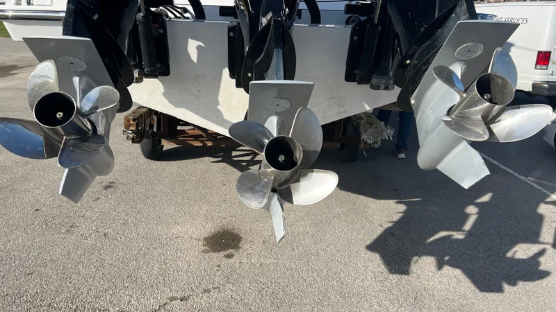 Slide: The Image of 2021 Monterey 385 SE boat propellers on display in a parking lot. - 43