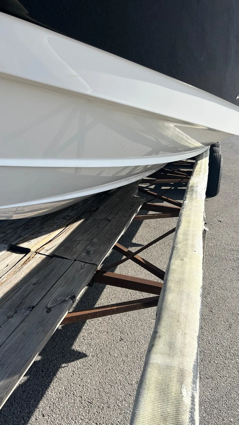 Slide: The Image of 2021 Monterey 385 SE boat on trailer, side view. - 44