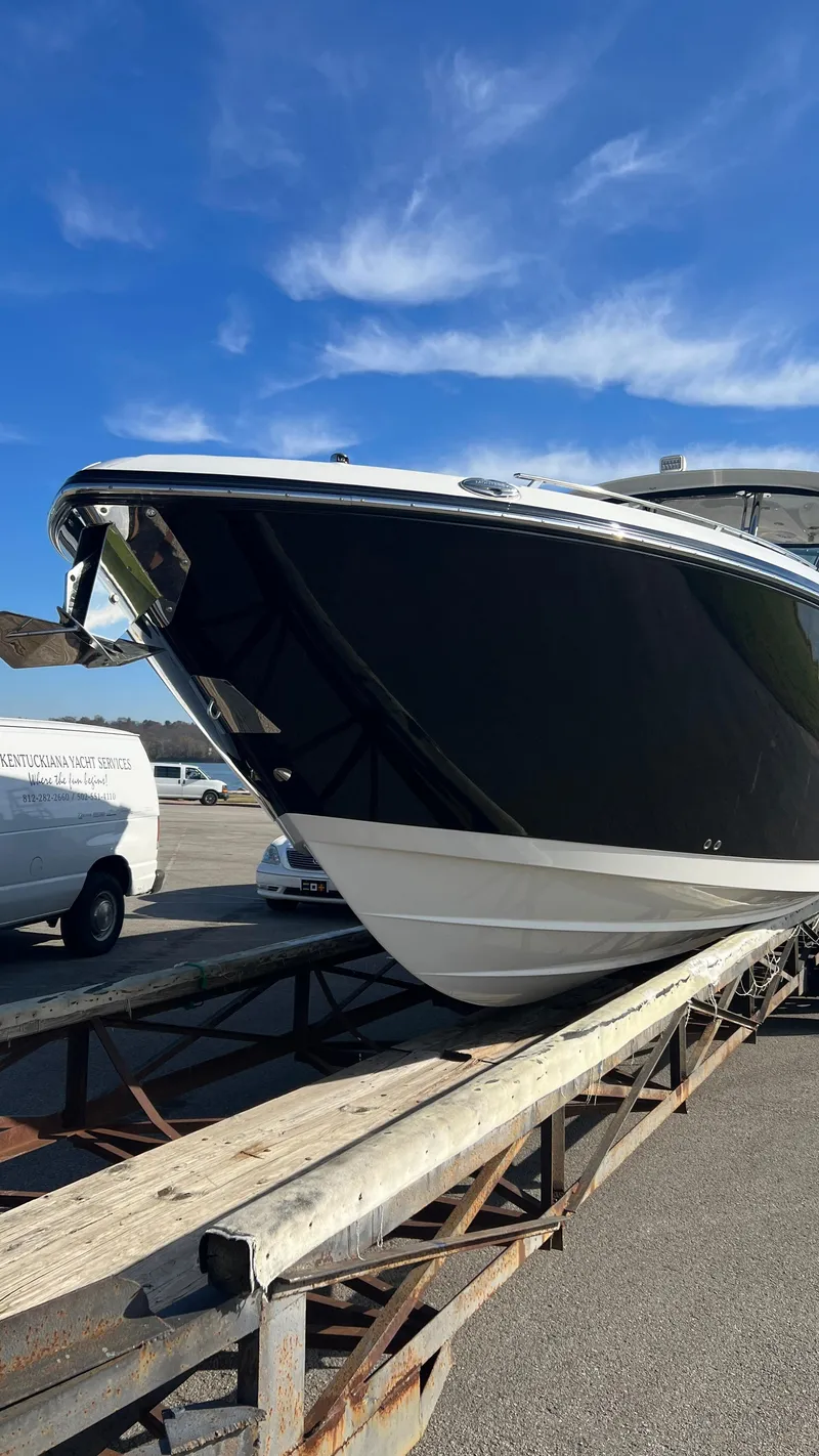 Slide: The Image of 2021 Monterey 385 SE boat on trailer under clear blue sky. - 5