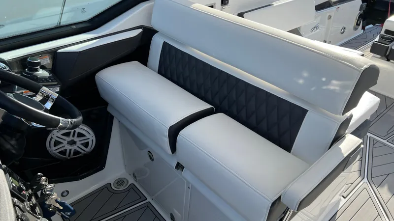 Slide: The Image of Luxury seating in 2021 Monterey 385 SE boat cockpit, featuring sleek design and modern controls. - 7