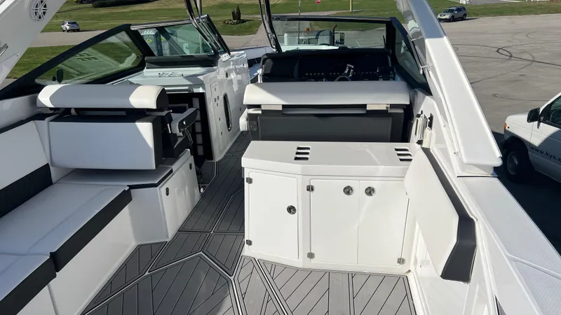 Slide: The Image of 2021 Monterey 385 SE boat interior with sleek seating and modern design. - 8
