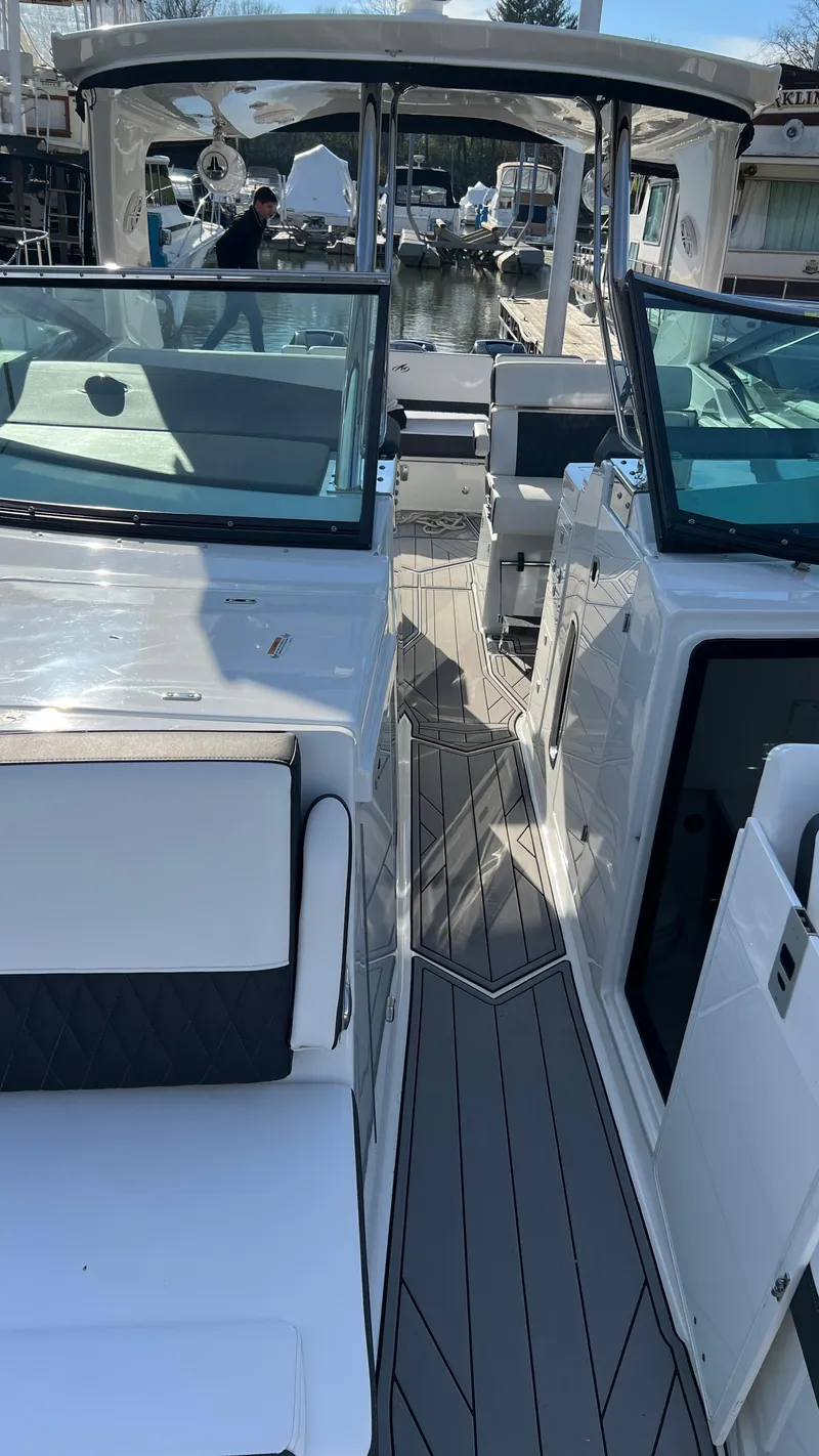 Slide: The Image of 2021 Monterey 385 SE boat interior with sleek seating and modern design. - 9