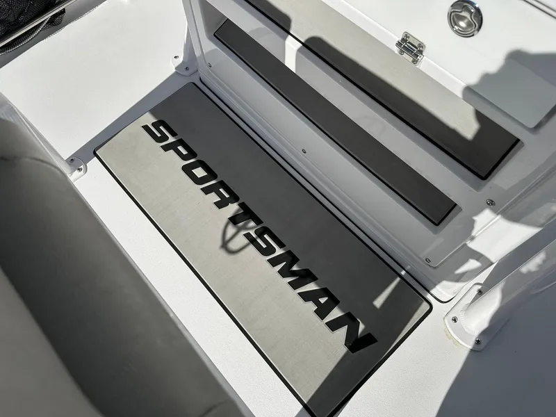 Slide: The Image of 2023 Sportsman Open 212 Center Console boat interior with branded mat. - 13