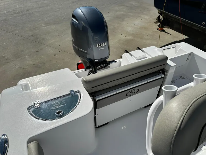 Slide: The Image of 2023 Sportsman Open 212 Center Console boat with Yamaha 150 engine, rear seating, and storage. - 14