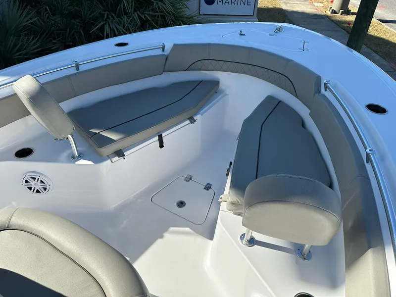Slide: The Image of 2023 Sportsman Open 212 Center Console boat interior with cushioned seating and storage. - 18