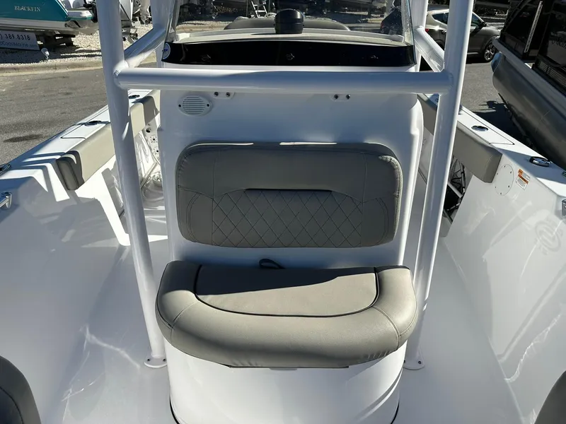 Slide: The Image of 2023 Sportsman Open 212 Center Console boat with cushioned seating and sturdy frame. - 19