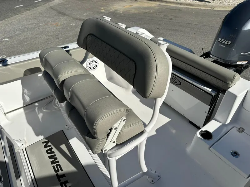 Slide: The Image of 2023 Sportsman Open 212 Center Console boat interior with cushioned seating and Yamaha 150 engine. - 22