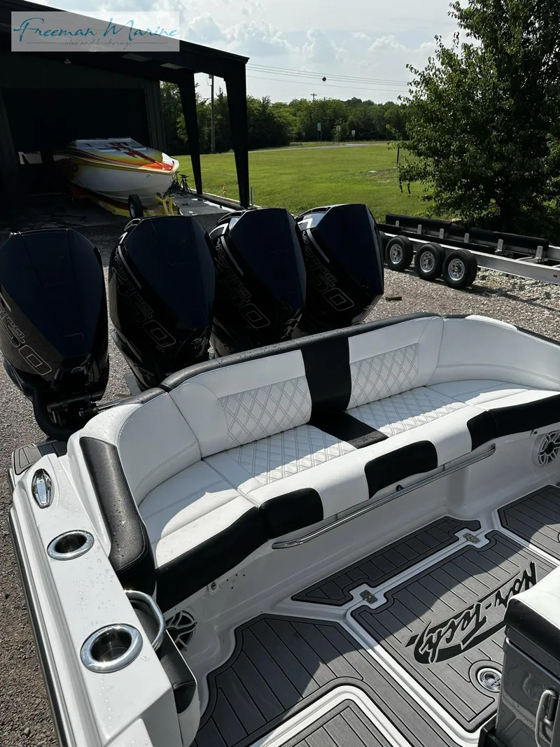 Slide: The Image of 2022 Nor-Tech 390 Center Console with quad engines and luxurious seating. - 10