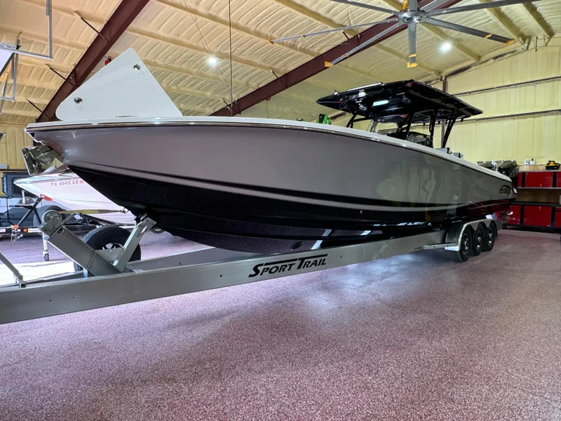 Slide: The Image of 2022 Nor-Tech 390 Center Console boat on a Sport Trail trailer in a warehouse. - 15