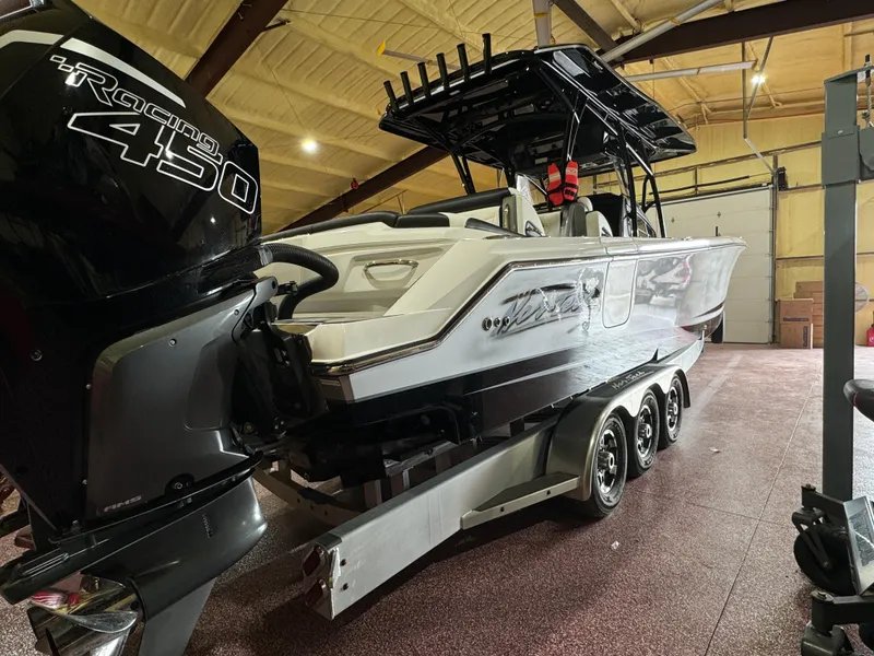 Slide: The Image of 2022 Nor-Tech 390 Center Console boat with Mercury Racing 450 engine in a garage. - 20