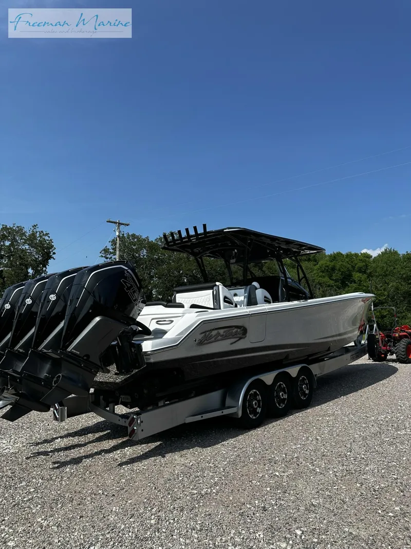 Slide: The Image of 2022 Nor-Tech 390 Center Console boat with triple outboard engines on a trailer. - 6